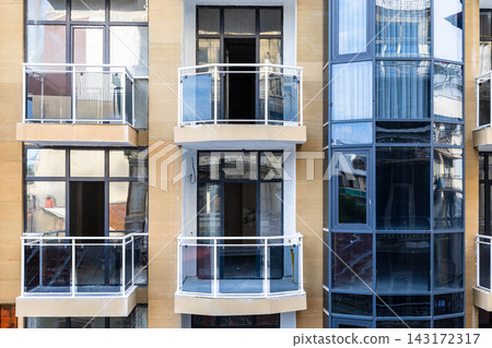 front view of balconies on facade of new building front view of balconies on facade of new building 143172317