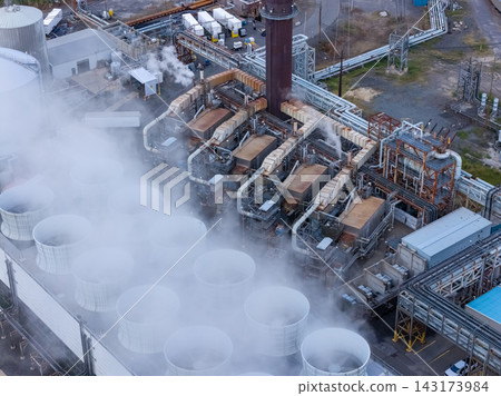 Aerial close up of industrial cooling tower fan stacks at facility Aerial close up of industrial cooling tower fan stacks at facility 143173984