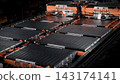 EV car service. Electric vehicle battery pack being serviced or inspected in automotive workshop. Large battery modules and high voltage components. Modern EV power systems. Lithium ion NMC NCA or LFP 143174141
