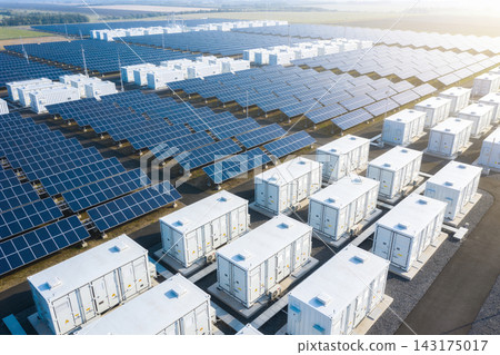 Aerial view of a large solar farm with battery energy storage systems in a rural landscape Aerial view of a large solar farm with battery energy storage systems in a rural landscape 143175017