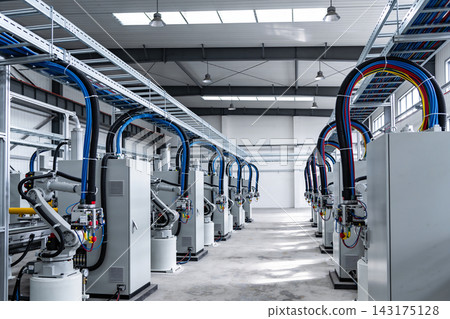 Automated robotic assembly line in a modern industrial manufacturing facility warehouse interior Automated robotic assembly line in a modern industrial manufacturing facility warehouse interior 143175128