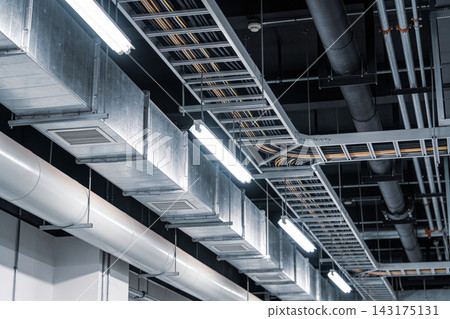 Industrial ceiling infrastructure with metal ventilation ducts and electrical cable trays Industrial ceiling infrastructure with metal ventilation ducts and electrical cable trays 143175131