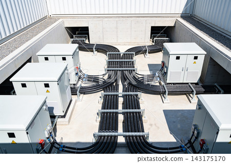 Industrial electrical power distribution system with heavy cables and metal transformer cabinets Industrial electrical power distribution system with heavy cables and metal transformer cabinets 143175170