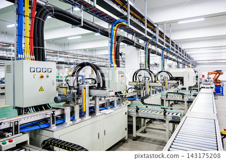 Automated industrial assembly line with electrical control panels in a modern manufacturing plant Automated industrial assembly line with electrical control panels in a modern manufacturing plant 143175208