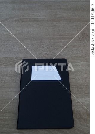Minimalist vertical black notebook with negative space 143175669