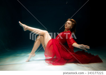 Dynamic marine dance featuring performer in striking red dress Dynamic marine dance featuring performer in striking red dress 143177221