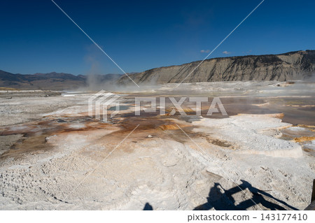 Views of Mammoth Hot Springs on a sunny day at Yellowstone National Park. Views of Mammoth Hot Springs on a sunny day at Yellowstone National Park. 143177410