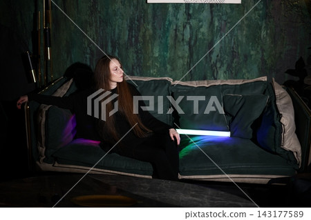 Chilled storyteller resting with soft glow and gentle smile Chilled storyteller resting with soft glow and gentle smile 143177589