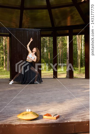 Caucasian ballerina dramatic interpretive reach on stage Caucasian ballerina dramatic interpretive reach on stage 143177770