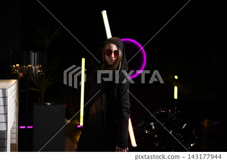 Nightlife ambiance captured with vibrant neon and reflective elements Nightlife ambiance captured with vibrant neon and reflective elements 143177944