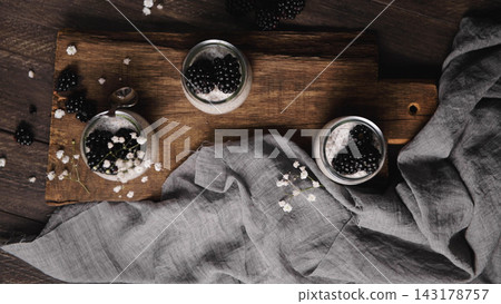 Chia seed pudding with fresh blackberries on a wooden board Chia seed pudding with fresh blackberries on a wooden board 143178757