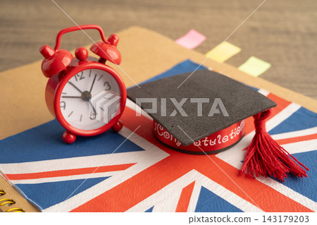 UK flag with graduate hat on english language book. 143179203