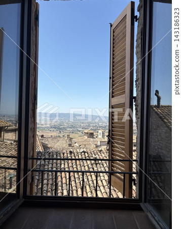 The cityscape as seen from a window in Assisi, an Italian pilgrimage site. The cityscape as seen from a window in Assisi, an Italian pilgrimage site. 143186323