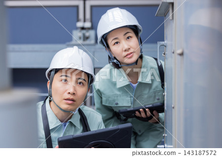 Building maintenance staff inspecting equipment. Photo courtesy of Denpa Gakuen, Tokyo Electronics College. Building maintenance staff inspecting equipment. Photo courtesy of Denpa Gakuen, Tokyo Electronics College. 143187572