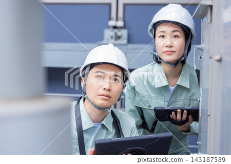 Building maintenance staff inspecting equipment. Photo courtesy of Denpa Gakuen, Tokyo Electronics College. Building maintenance staff inspecting equipment. Photo courtesy of Denpa Gakuen, Tokyo Electronics College. 143187589