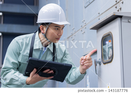 Building maintenance: A man inspecting equipment. Photo courtesy of Denpa Gakuen, Tokyo Electronics College. Building maintenance: A man inspecting equipment. Photo courtesy of Denpa Gakuen, Tokyo Electronics College. 143187776