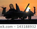 Jet Fighter and pilot walking on flight deck at sunset 143188932