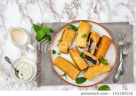 sweet thin rolled crepes with poppy seed sweet thin rolled crepes with poppy seed 143190158
