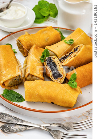 Makos palacsinta Hungarian sweet thin crepes rolls Makos palacsinta Hungarian sweet thin crepes rolls 143190163