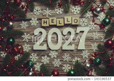 Hello 2027 alphabet letters with Christmas decoration on wooden background 143190537