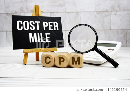 CPM Constant Payment Mortgage text with calculator magnifying glass and on wooden background CPM Constant Payment Mortgage text with calculator magnifying glass and on wooden background 143190854