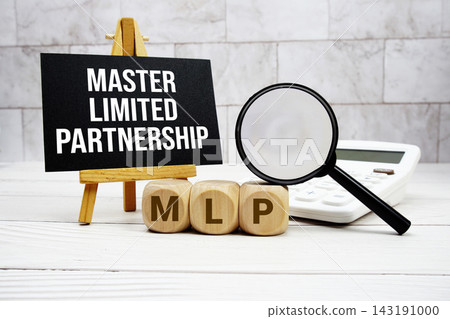 MLP Master Limited Partnership text with calculator magnifying glass and on wooden background MLP Master Limited Partnership text with calculator magnifying glass and on wooden background 143191000
