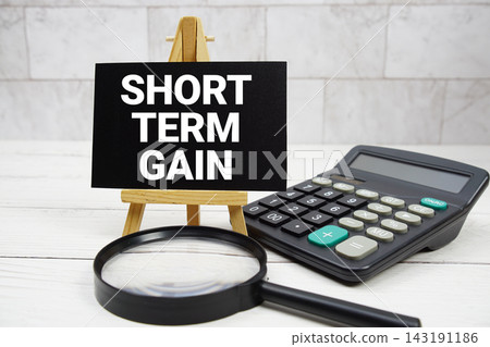 Short Term Gain text with calculator and magnifying glass 143191186