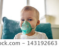 Cute little kid boy wear use medical nebulizer mask inhaling steam respiratory therapy lungs rsv allergic disease cure. Portrait child treating seasonal respiratory bronchitis cough medical inhaler 143192663