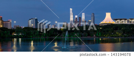 Nanning skyline at dusk with modern buildings and illuminated fo Nanning skyline at dusk with modern buildings and illuminated fo 143194078