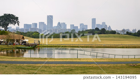 Nanning skyline view from Qingxiu Mountain Park with serene lake Nanning skyline view from Qingxiu Mountain Park with serene lake 143194095