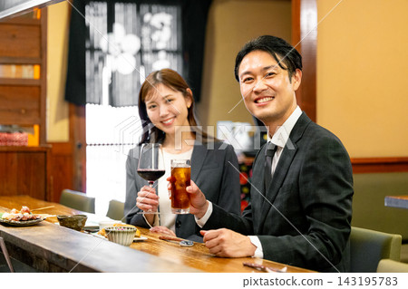 A man toasting in a pub A man toasting in a pub 143195783