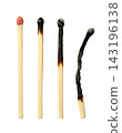 A set of burnt wooden matchsticks close-up on a white background. Isolated 143196138