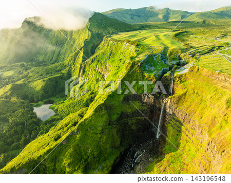Ribeira Grande Waterfall, Green Lush Cliffs. Flores Island, Azores, Portugal Ribeira Grande Waterfall, Green Lush Cliffs. Flores Island, Azores, Portugal 143196548