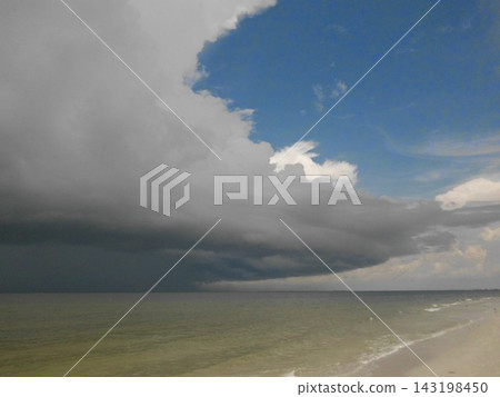 Giant Thunderstorm Cloud Approaching Fort Myers Beach Florida From The Beach  143198450