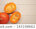 Half of Hokkaido pumpkin on light wooden background. Space for text 143198662