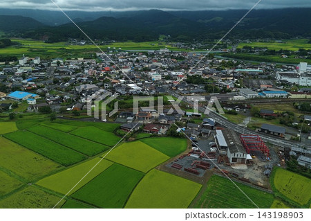 Aerial photograph capturing rice paddies and urban areas in Ebino City, Miyazaki Prefecture. Aerial photograph capturing rice paddies and urban areas in Ebino City, Miyazaki Prefecture. 143198903