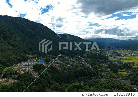 Aerial photograph capturing a mountain village and construction site in Yufu City, Oita Prefecture. Aerial photograph capturing a mountain village and construction site in Yufu City, Oita Prefecture. 143198919