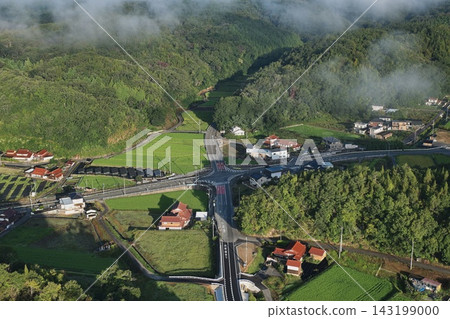 An aerial photograph capturing the fog and intersection in a rural area of Mihara City, Hiroshima Prefecture. An aerial photograph capturing the fog and intersection in a rural area of Mihara City, Hiroshima Prefecture. 143199000