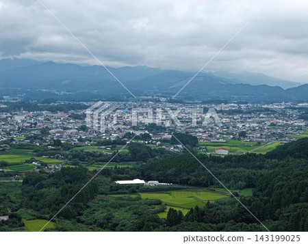Aerial photograph capturing the basin town and fields of Kobayashi City, Miyazaki Prefecture. 143199025