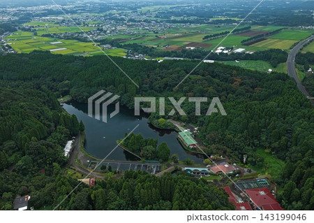 Aerial photograph capturing the rural settlements around Izunoyama Pond in Kobayashi City, Miyazaki Prefecture. Aerial photograph capturing the rural settlements around Izunoyama Pond in Kobayashi City, Miyazaki Prefecture. 143199046