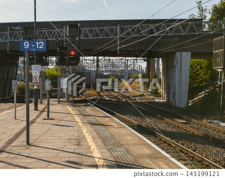 Red Railway Signal at an English Train Station Signaling Stop and Safety Red Railway Signal at an English Train Station Signaling Stop and Safety 143199121