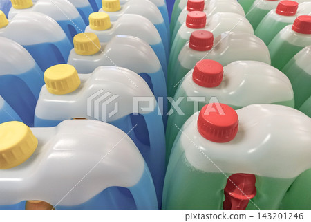 Plastic containers with blue and green windshield washer fluid Plastic containers with blue and green windshield washer fluid 143201246