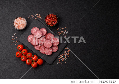 Sliced salami sausage, smoked meat as a delicacy for the table. Salami sausage 143201352
