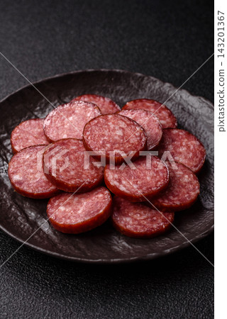 Sliced salami sausage, smoked meat as a delicacy for the table. Salami sausage Sliced salami sausage, smoked meat as a delicacy for the table. Salami sausage 143201367