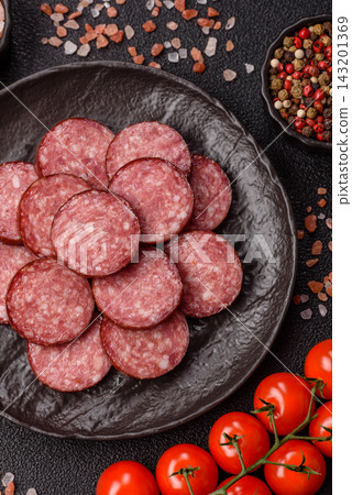 Sliced salami sausage, smoked meat as a delicacy for the table. Salami sausage Sliced salami sausage, smoked meat as a delicacy for the table. Salami sausage 143201369