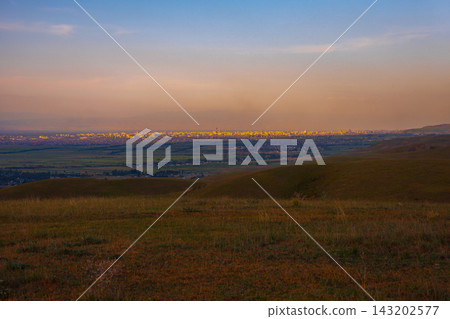 Panoramic View of Distant Cityscape at Golden Hour Panoramic View of Distant Cityscape at Golden Hour 143202577
