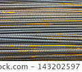 Stacked Rebar Rods with Rust Texture Close-Up 143202597