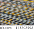 Close-up of Rusty Rebar Stack with Textured Surface 143202598