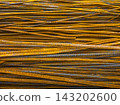 Close-up of Stacked Rusty Rebar in Construction 143202600