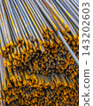 Close-Up of Steel Rebar Pile with Yellow Coating 143202603